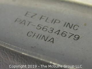 Handle activated "flipper" metal slotted spatula; marked E Z Flipper