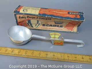 "Scadle"; "The Economical Ladle with the Built In Scale"; in original box