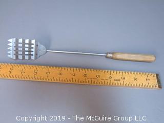 Waffle Stainless Spatula with wood handle; unpainted