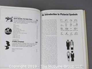 Book Title: "Designing Pictorial Symbols"; authored by Nigel Holmes with Rose DeNeve; published by Watson-Guptill; 1985