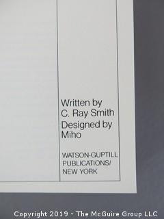 Book Title: "AIGA Graphic Design USA: 1 -The Annual of the American Institute of Graphic Arts"; authored by C. Ray Smith; designed by Miho; published by Watson-Giptill, New York;  1980