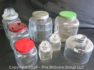 Assorted Shapes and Sizes of Clear Glass Canisters 