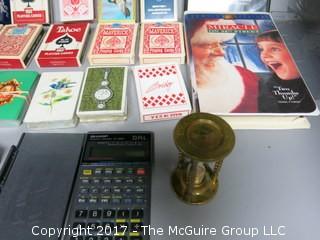 Collection including playing cards, cigar boxes, fishing tackle, keepsake box, Army backpack, NIB knife set and SHARP calculator