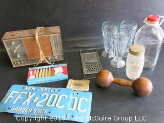 Collection including milk bottle, NJ license plates, wooden dumbell, (3) sofa fountain ice cream sundae glasses, kitchen grater and Zenith Radio