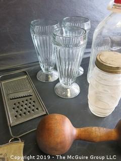 Collection including milk bottle, NJ license plates, wooden dumbell, (3) sofa fountain ice cream sundae glasses, kitchen grater and Zenith Radio