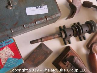 Collection of old tools including toolbox, arbor, (2) hand drills, hatchet blade, flat iron and NIB clothespins  