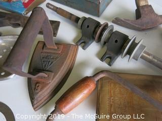 Collection of old tools including toolbox, arbor, (2) hand drills, hatchet blade, flat iron and NIB clothespins  