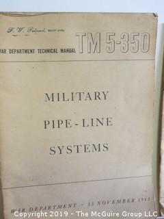 Collection of books including U.S. Military Manuals and Time Magazine:"Background For War"