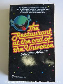 Collection of books including including authors Robert A. Heinlein, Arthur C. Clarke, Douglas Adams, Kurt Vonnegut Jr., and Aldous Huxley 