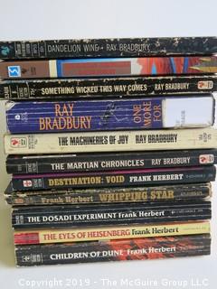 Collection of books including Ray Bradbury and Frank Herbert