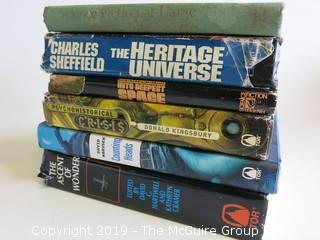 Collection of books including authors Charles Sheffield, Donald Kingsbury and David Harusek
