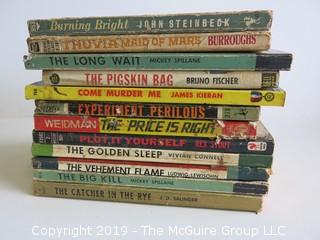 Collection of books including authors Steinbeck, Burroughs, Mickey Spillane, Bruno Fischer, James Kieran, Carpenter, Weidman, Rex Stout, Vivian Connell, Ludwig Lewisohm and J.D. Salinger