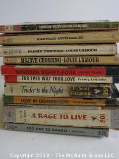 Collection of books including authors Louis L:'Amour, Orwell, Lewisohn, F. Scott Fitzgerald, David Greenwood, John O'Hara and Ian Fleming