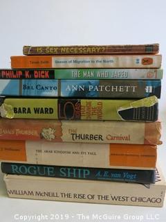 Collection of books including authors Philip K. Dick, Ann Patchett, Barbara Ward, James Thurber and A.E. van Vogt