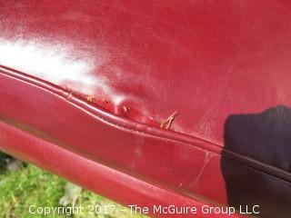 Red Leather Wing Back Chair (Note: needs some re-stitching; bottom wooden stretcher has been re-glued)