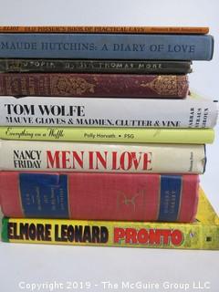 Collection of books including authors Eliot, Maude Hutchins, Sire Thomas Moore, Jane Austen, Tom Wolfe, Polly Horvath, Nancy Friday and Elmore Leonard