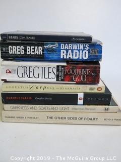 Collection of books including authors Greg Bear, Greg Iles, Dorothy Parker and William Irwin Thompson