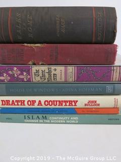 Collection of books including authors Adina Hoffman