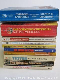 Collection of books including authors Donaldson, Moorcock, Garrett and Heydron, Caiden, Prescot, Martin Thomas, Delany, CurtSlodmak and Ron Goulart     