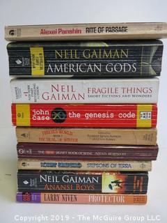 Collection of books including authors Panshin, Gaiman, Bespaloff. Slerrer, Niven