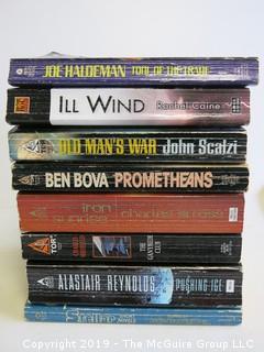 Collection of books including authors THaldeman, Caine, Scalzi, Ben Bova, Stross, Sheffield and Reynolds