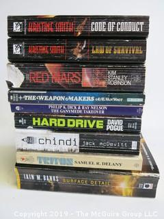 Collection of books including authors Kristine Smith, K.S. Robison, A.E. van Vogt, Dick, Pogue, McDevitt, Delany and Iain M. Banks