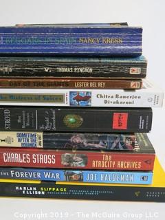 Collection of books including authors Kress, Pynchon, Del Ray, Divakarumi, Stroud, Jorj Bent, Stross, Haldeman and Ellison