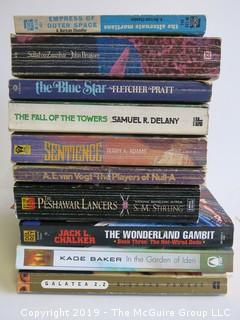 Collection of books including authors A. Bertram Chandler, Brunner, Fletcher Pratt, Delany, Terry Adams, A.E. van Vogt, S. M. Sterling. Jack L. Chalker, Kage Baker and Richard Powers