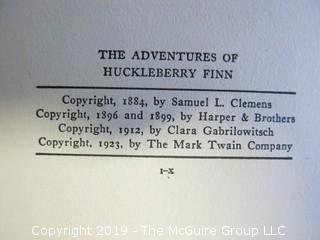 (2) Books: "The Adventures of Tom Sawyer" and "The Adventures of Huckleberry Finn"; both by Mark Twain; published by Harper and Brothers  