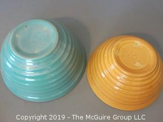 Collection including two glazed ceramic kitchen mixing bowls and set of (6) colored pressed glass stems 