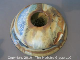 Glazed stoneware footed trivet; signed "Colby"; 7 1/2" base diameter {Description altered 6.13 @3:27pm ET}  