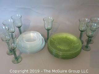 Collection of glass dinner plates and stems