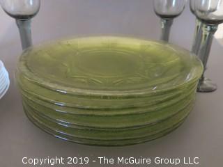 Collection of glass dinner plates and stems