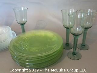 Collection of glass dinner plates and stems