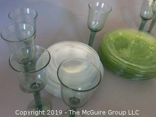 Collection of glass dinner plates and stems