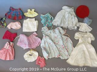 Collection of doll clothes and accessories; includes Vogue box and contents as well as 1935 Raggedy Ann Coin Purse