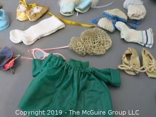 Collection of doll clothes and accessories; includes Vogue box and contents as well as 1935 Raggedy Ann Coin Purse