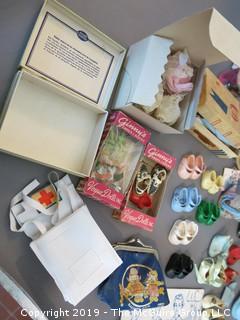 Collection of doll clothes and accessories; includes Vogue box and contents as well as 1935 Raggedy Ann Coin Purse