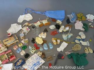 Collection of doll clothes and accessories; includes Vogue box and contents as well as 1935 Raggedy Ann Coin Purse