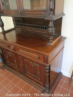 South American 2 sectional cupboard with double glass panel doors; resting on a raised panel cabinet base; 55"Wide x 90"Tall x 24 1/2"Deep; {Description altered 6.13.2019 @3:12pm ET} 