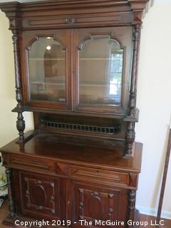 South American 2 sectional cupboard with double glass panel doors; resting on a raised panel cabinet base; 55"Wide x 90"Tall x 24 1/2"Deep; {Description altered 6.13.2019 @3:12pm ET} 