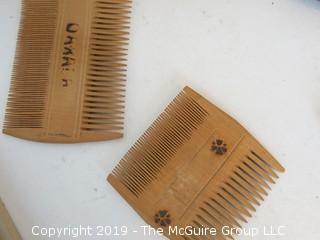 Collection including baskets, wooden combs, an ostrich egg and a handmade paper book.