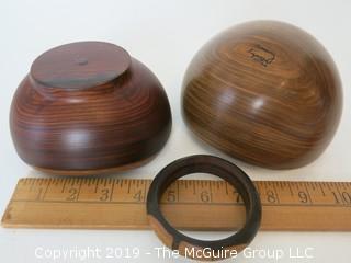 (2) Lathe turned wooden sculptural bowls; one signed 