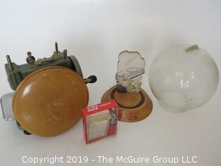 Collection including an oversized wooden yo-yo, a vintage savings bank, and a miniature "Betsy Ross" sewing machine