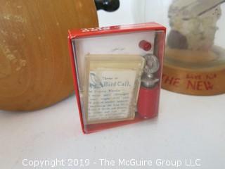 Collection including an oversized wooden yo-yo, a vintage savings bank, and a miniature "Betsy Ross" sewing machine