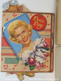 Collection including Doris Day doll cutouts and David Levine Caricatures