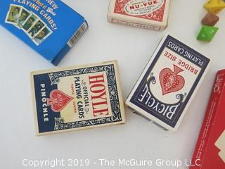 Collection including various packs of vintage playing cards and dice