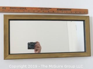 Rectangular wall mirror in wood frame; 9 x 18"