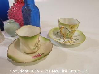 Collection of mostly vintage bottles, ashtrays and porcelain tea cups/saucers