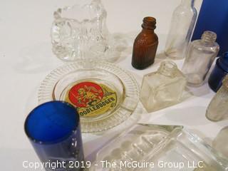 Collection of mostly vintage bottles, ashtrays and porcelain tea cups/saucers